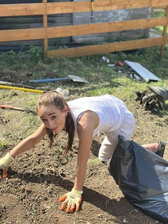 Tending the communal garden as part of daily routine