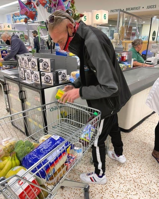 A resident doing the weekly food shop with support